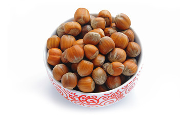 a bowl full of hazelnuts