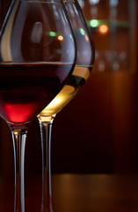Two glasses of wine in a bar