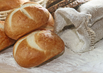 assortment of baked bread on wood table
