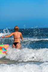 Fototapeta premium Woman running in the sea