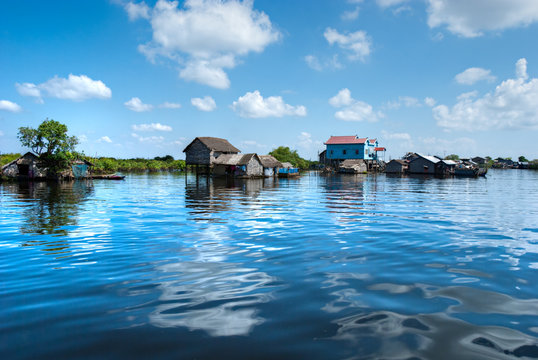 Floating House and  Houseboat on the Tonle Sap lake, Cambodia.