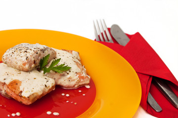 Grilled salmon with cream sauce and parsley