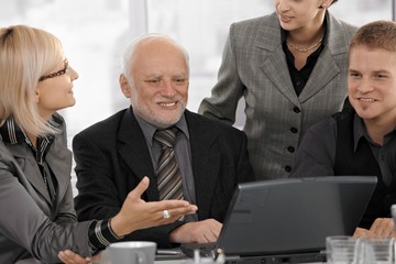 Fototapeta premium Businesswoman explaining work to colleagues