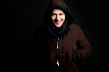 fashion male portrait with a hodded coat