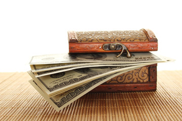 Chest filled with one hundred dollar bills