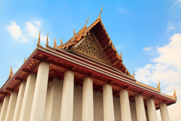 Ancient buddha temple in Bangkok nice bright blue sky background