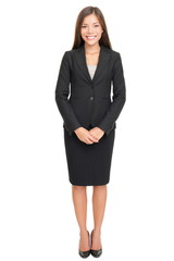 Beautiful young businesswoman standing on white background © Maridav