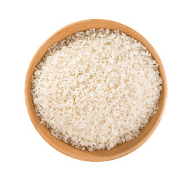 Fototapeta na wymiar rice grain in wooden plate isolated on white