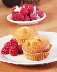 golden muffins with raspberries