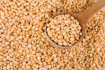 wood spoon and pea grain