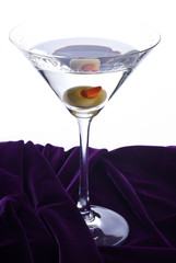 Classic Martini Cocktail Sitting on Purple Velvet