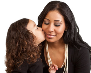 Young girl kisses her mother