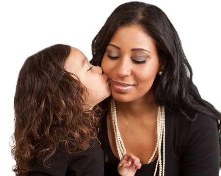 Young girl kisses her mother