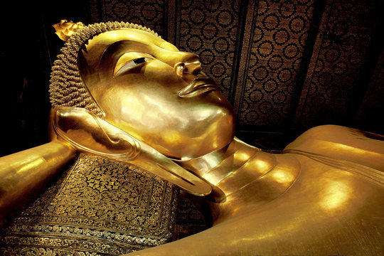 The gold Reclining Buddha in Wat Pho, Bangkok Thailand