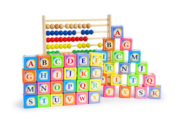 Alphabet blocks and abacus isolated on white