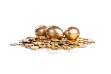 Three golden eggs on coins