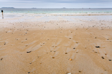 pebble stones on sand beach in low tide