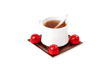 A cup of tea with sweets