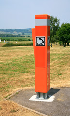 orange lightreflecting traffic box SOS