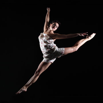 Elegant dancer jumping in air