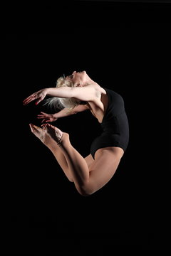 Dancer jumping in backward curl