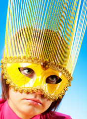 Attractive woman posing in the stylish mask