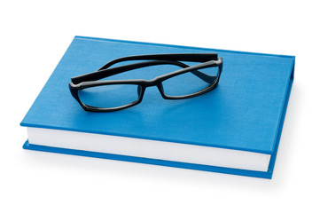 Reading glasses with books isolated on the white