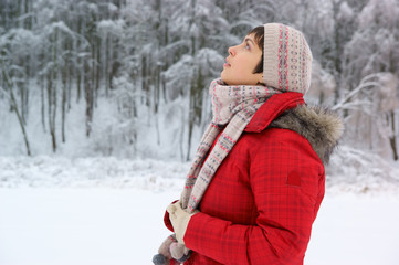 Fototapeta premium Young woman in the winter forest