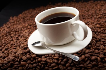 Fototapeta premium coffee beans with white cup