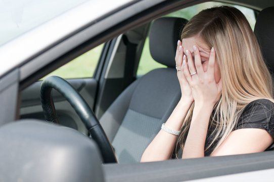 In troubles - unhappy woman in car