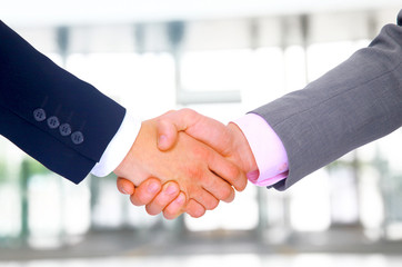 Business men hand shake in the office