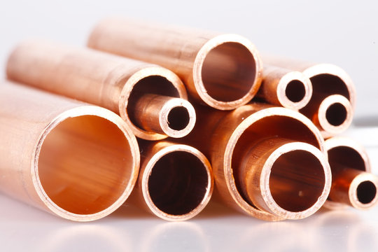 Set of copper pipes of different diameter
