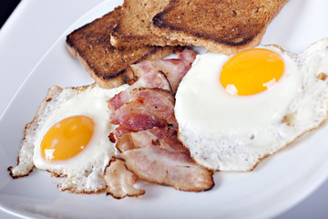 Breakfast - toasts, eggs, bacon
