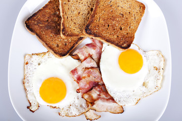 Breakfast - toasts, eggs, bacon