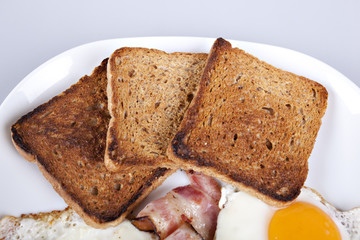 Breakfast - toasts, eggs, bacon