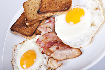 Breakfast - toasts, eggs, bacon