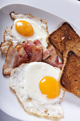 Breakfast - toasts, eggs, bacon