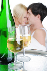 Young couple drinking champagne in bed