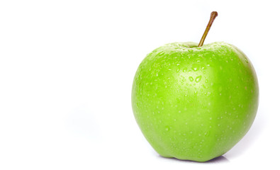 wet green apple on the white background