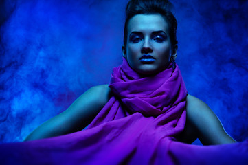 Portrait of the beautiful girl in dark tones