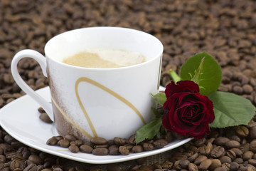 cup of coffee and red rose
