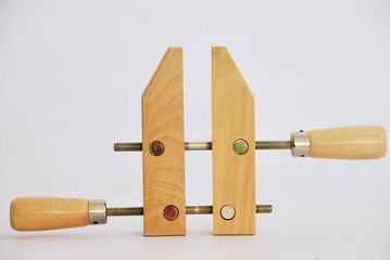 Old-fashioned wooden clamp isolated on white background