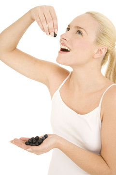 Woman Eating Blueberries