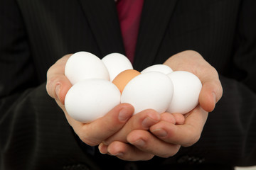 businessman with egg in the hands