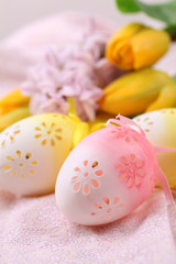 Fototapeta na wymiar Yellow and pink flowery Easter eggs