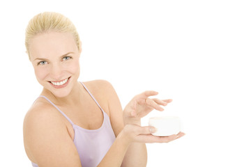 woman holding a jar of cream