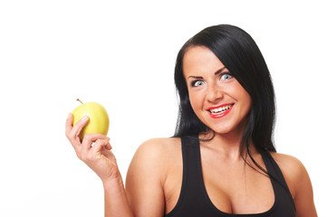 Fitness girl with green apple isolated on white