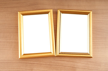 Fototapeta premium Picture frames on the polished wooden background