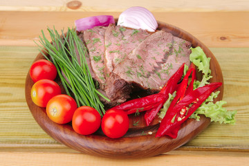 beef on wooden plate