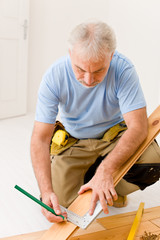 Home improvement - handyman installing wooden floor